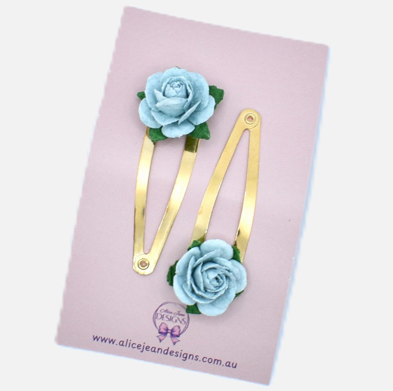 Rose gold snap clps with blue flowers