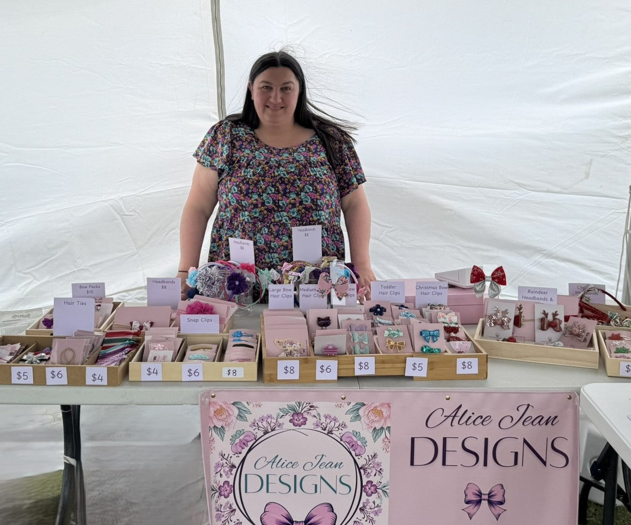 founder of Alice Jean Designs, Sarah, behind her market stall